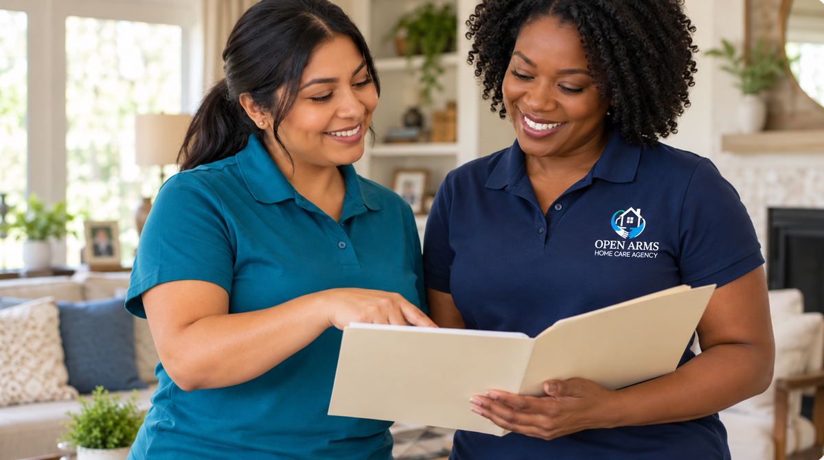 A Latina woman and a Black woman review a folder together as home-care colleagues.